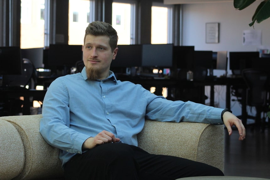 Man leaned back on sofa looking to the side